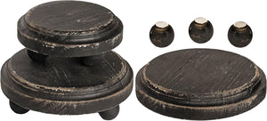 Black elevated tray with a black round wood riser and ceramic display riser.